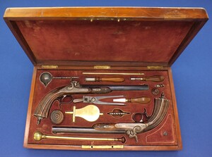 A fine antique 19th century Cased Pair Belgian Percussion Pistols, caliber 12 mm, length 42,5 cm, in near mint condition. 
