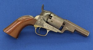 A scarce antique American Colt Model 1849 Wells Fargo Pocket 5 shot 31 caliber single action percussion Revolver. 3 inch barrel with 2 line New York address. Fine stagecoach Robbers scene on cylinder. In very good condition. 