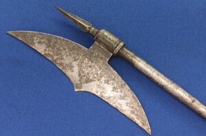 A very nice antique 19th century Eastern Indo - Persian Axe with rests of silver decorations, length 77 cm, in good condition