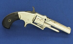 An antique American Nickel plated Marlin XXX Standard 1872 5 shot 30 Rimfire pocket Revolver. Fluted cylinder. Hard Rubber grips. Lenght 19 cm. In very good condition. Price 675 euro