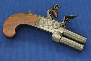 An antique English Tap-Action Box-Lock double barreled Flintlock Pocket Pistol by JACKSON LONDON circa 1800 with thumbpiece safety catch. Caliber 10mm, length 15cm. In very good condition. Price 795 euro
