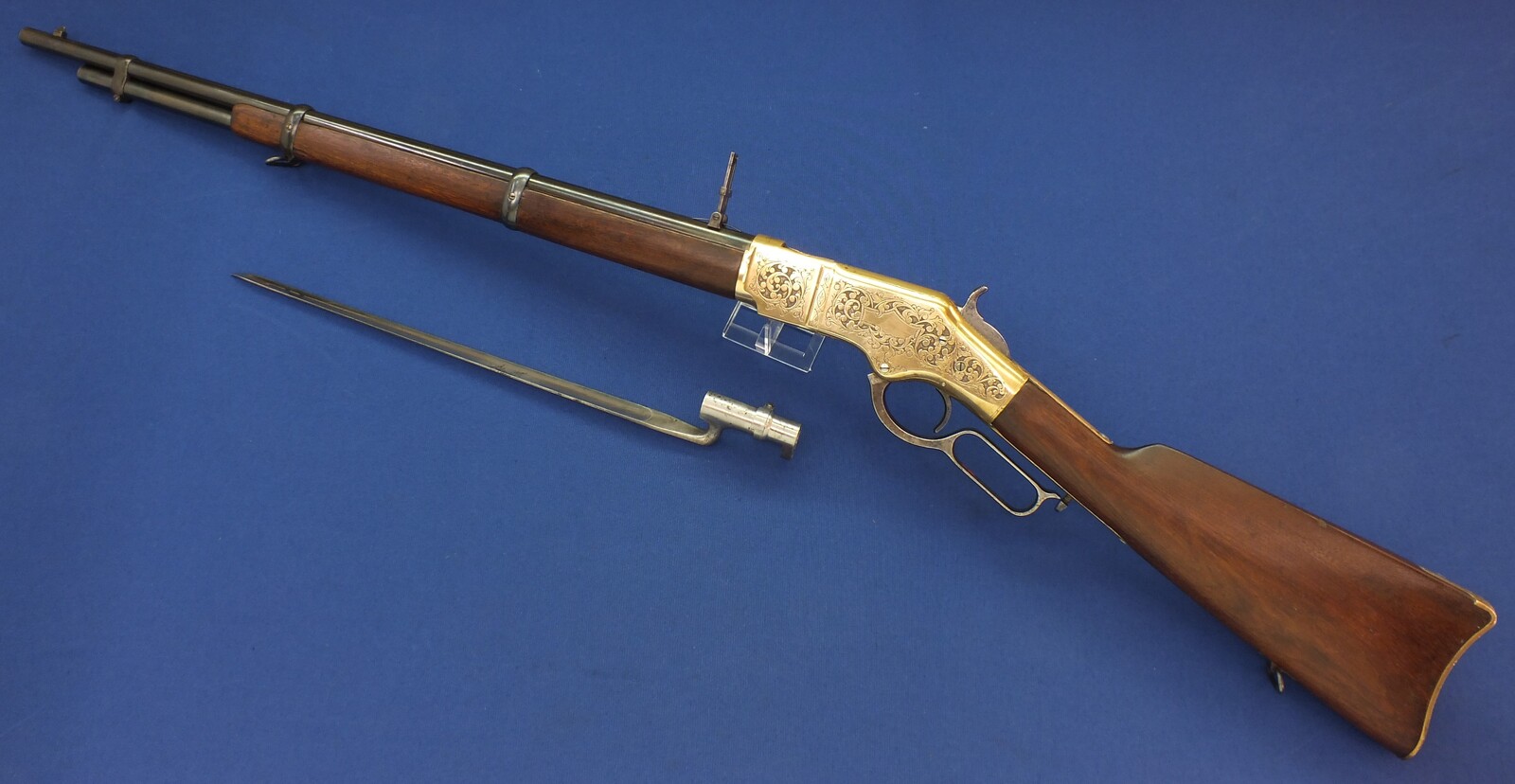 A fine antique American L.D. Nimschke Engraved Winchester Model 1866 Yellow Boy Musket with original Bayonet. 44 Henry centerfire caliber, 27 inch barrel. Length 118cm. In very good condition. Price on request