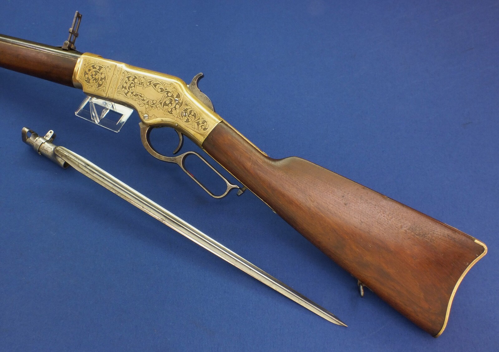 A fine antique American L.D. Nimschke Engraved Winchester Model 1866 Yellow Boy Musket with original Bayonet. 44 Henry centerfire caliber, 27 inch barrel. Length 118cm. In very good condition. Price on request