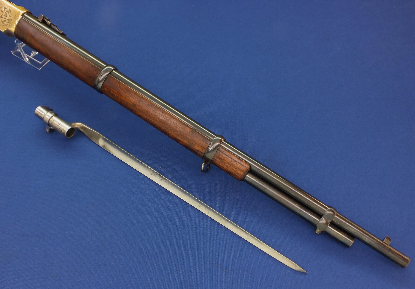 A fine antique American L.D. Nimschke Engraved Winchester Model 1866 Yellow Boy Musket with original Bayonet. 44 Henry centerfire caliber, 27 inch barrel. Length 118cm. In very good condition. Price on request