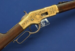 A fine antique American L.D. Nimschke Engraved Winchester Model 1866 Yellow Boy Musket with original Bayonet. 44 Henry Rimfire caliber, 27 inch barrel. Length 118cm. In very good condition. Price on request