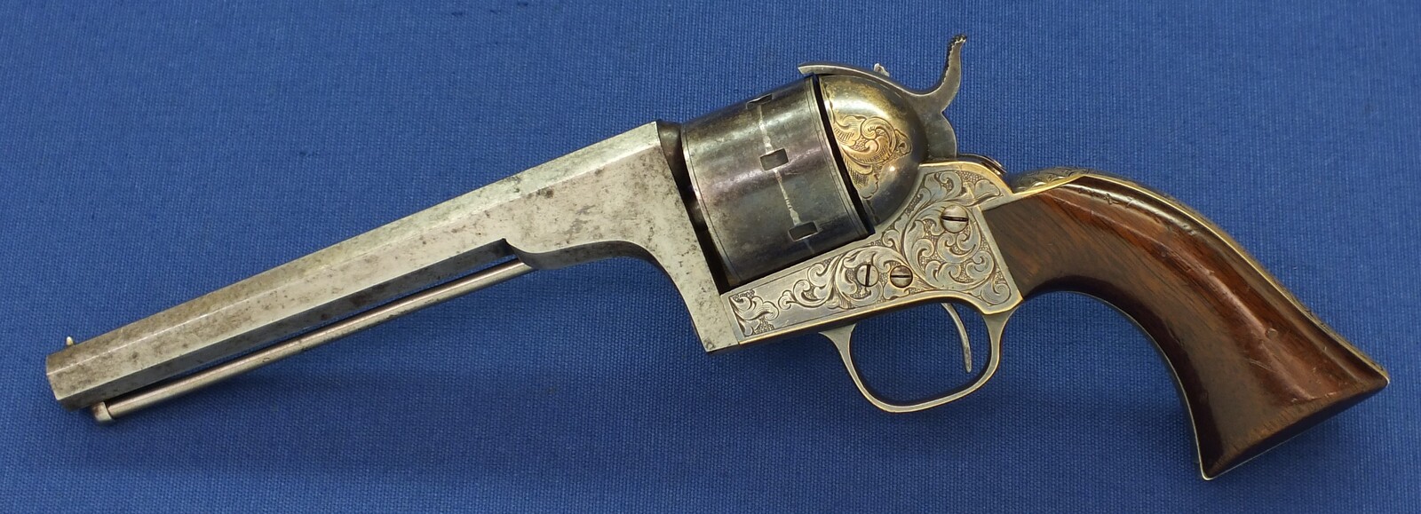 A fine antique American Moore's Patent Firearms Co Single Action Belt Revolver. 7 shot, Caliber 32 Rimfire. 6 inch octagon Barrel with clear address. Length 29cm. In very good condition