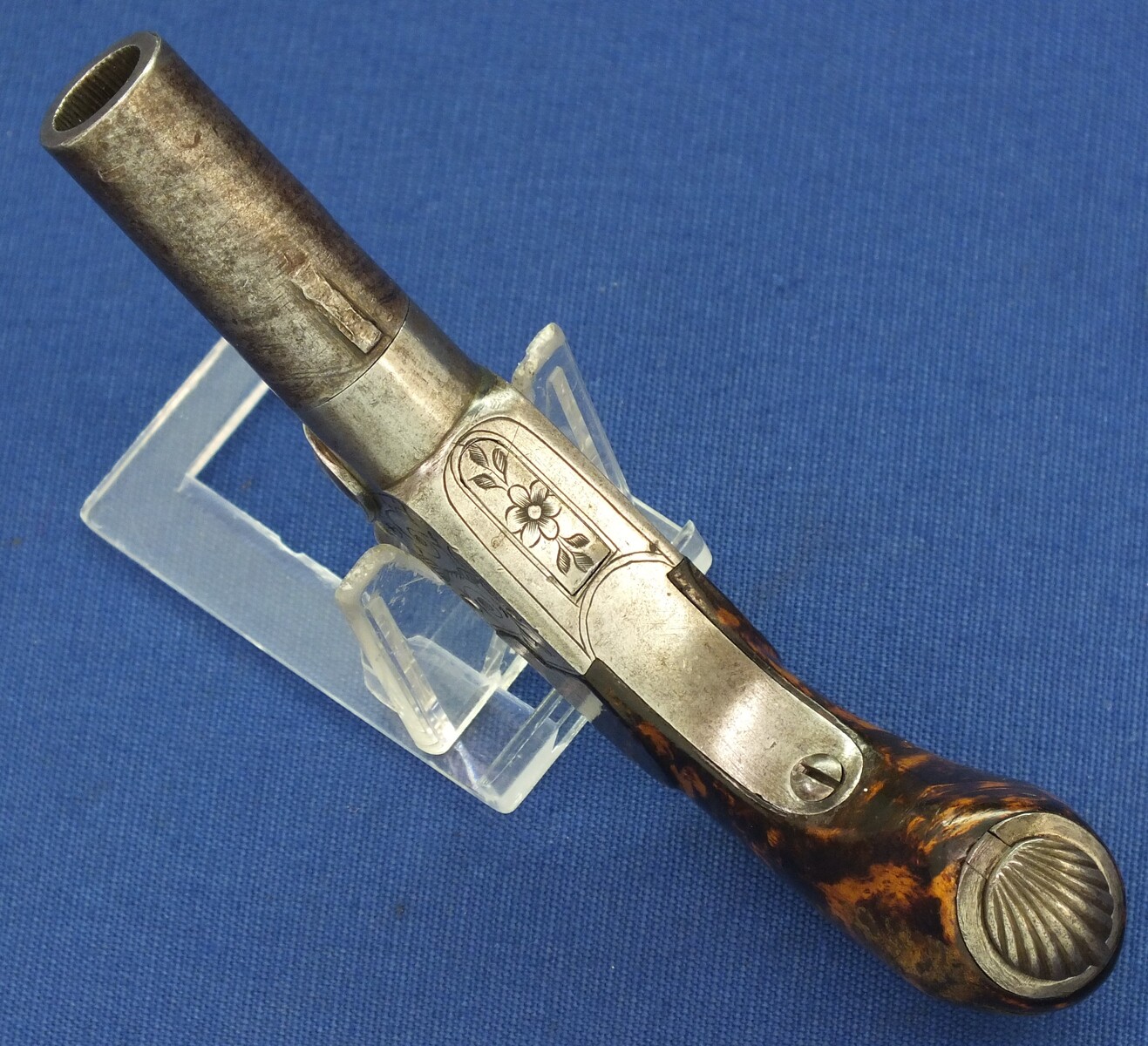 A fine antique Belgian circa 1850 Box-lock percussion Pistol with fine Root Walnut butt with unused Silver escutcheon and hinged lid with space for caps. Caliber 12mm, length 15,5cm. In very good condition. Price 750 euro.