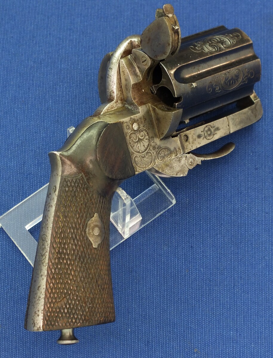 A fine antique French engraved 6 shot Double Action Pinfire Pepperbox. 8mm caliber. Length 17cm. In very good condition. Price 850 euro.