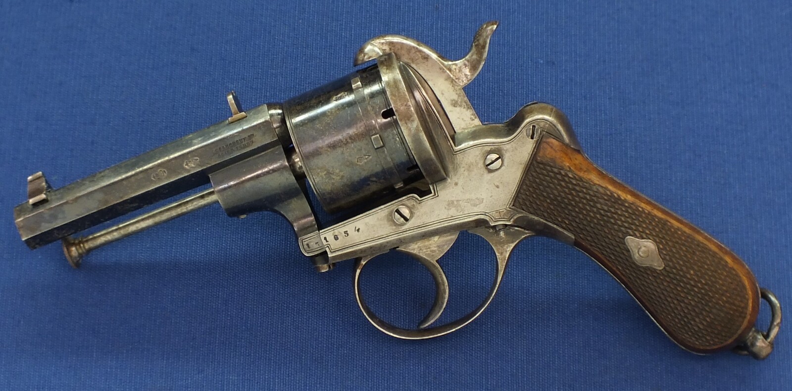 A fine antique Liege August Francotte Single&Double Action 6 shot 9mm Lefaucheux patent Pinfire revolver for the English market. Retailed by: J.F Crane, 3 Royal Exchange London. Length 23cm. In very good condition. Price 950 euro