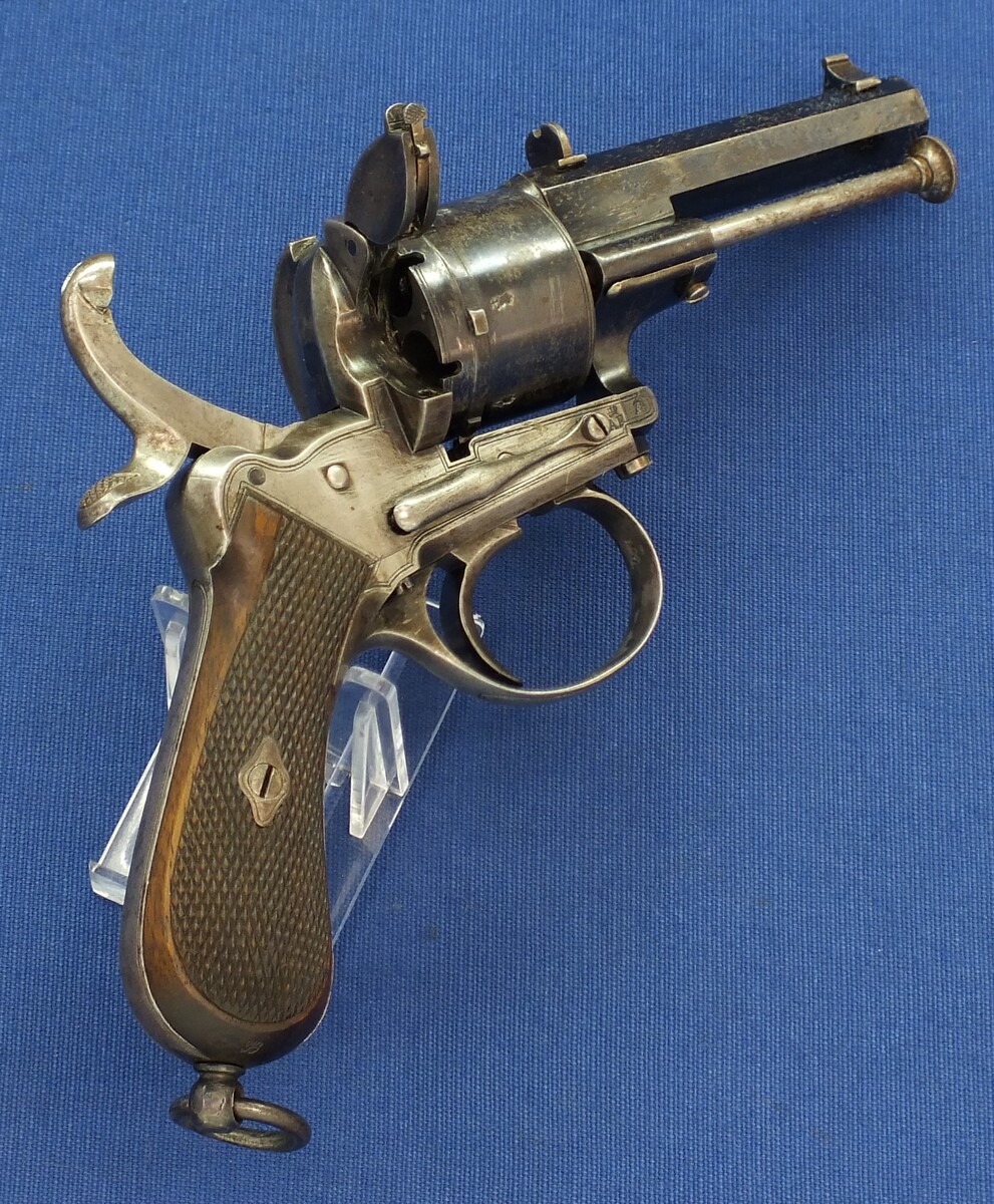 A fine antique Liege August Francotte Single&Double Action 6 shot 9mm Lefaucheux patent Pinfire revolver for the English market. Retailed by: J.F Crane, 3 Royal Exchange London. Length 23cm. In very good condition. Price 950 euro