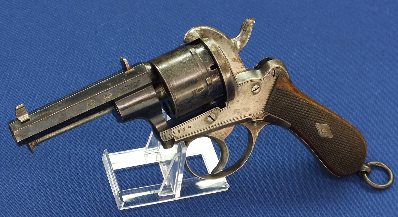 A fine antique Liege August Francotte Single&Double Action 6 shot 9mm Lefaucheux patent Pinfire revolver for the English market. Retailed by: J.F Crane, 3 Royal Exchange London. Length 23cm. In very good condition. Price 950 euro