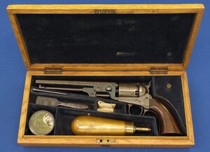 A fine antique Oak cased US-Made Colt 4th model 1851 Navy with large iron triggerguard sent to the London agency and probably distributed to Australia. 6 shot, caliber 36. 7,5inch barrel with U.S America address. In very good condition. 