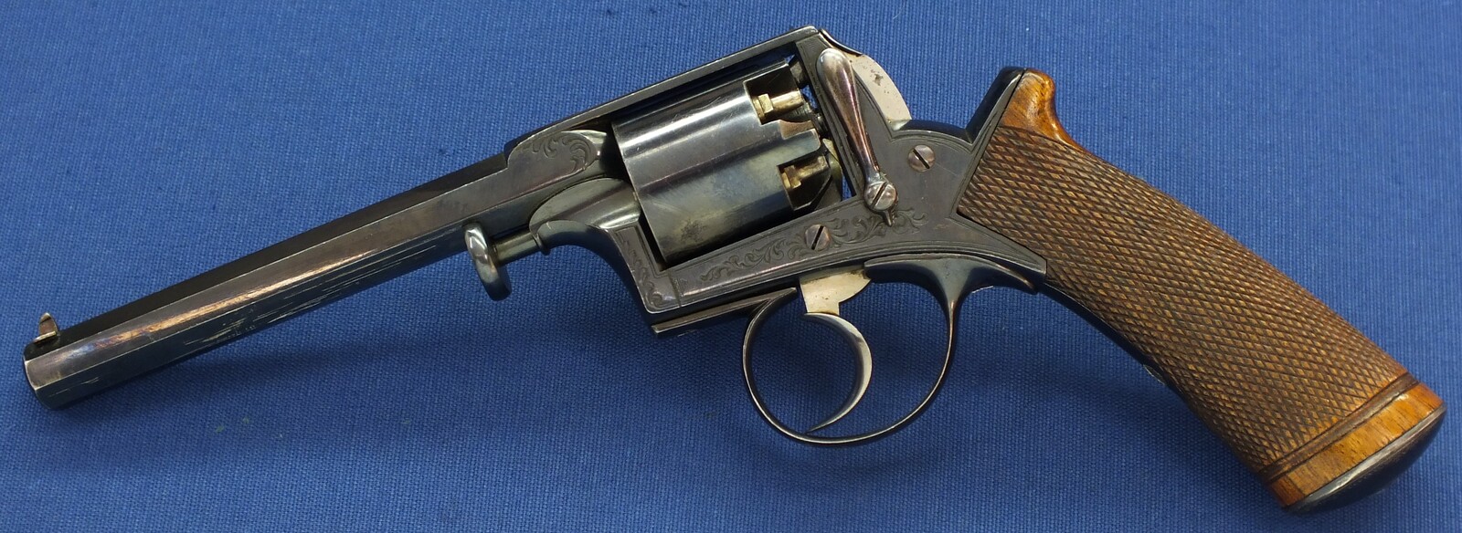 A fine antique probably Belgian made Adams Patent 5 shot double action percussion revolver. 38 Caliber. 5 inch barrel. Length 29cm. In near mint condition. 