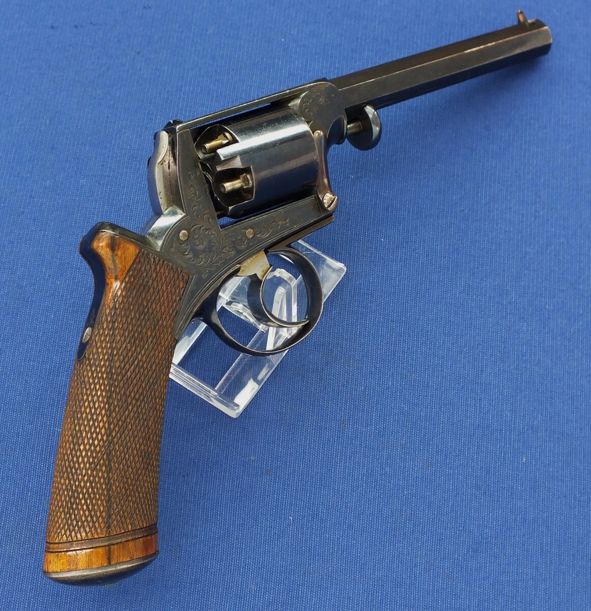 A fine antique probably Belgian made Adams Patent 5 shot double action percussion revolver. 38 Caliber. 5 inch barrel. Length 29cm. In near mint condition. 