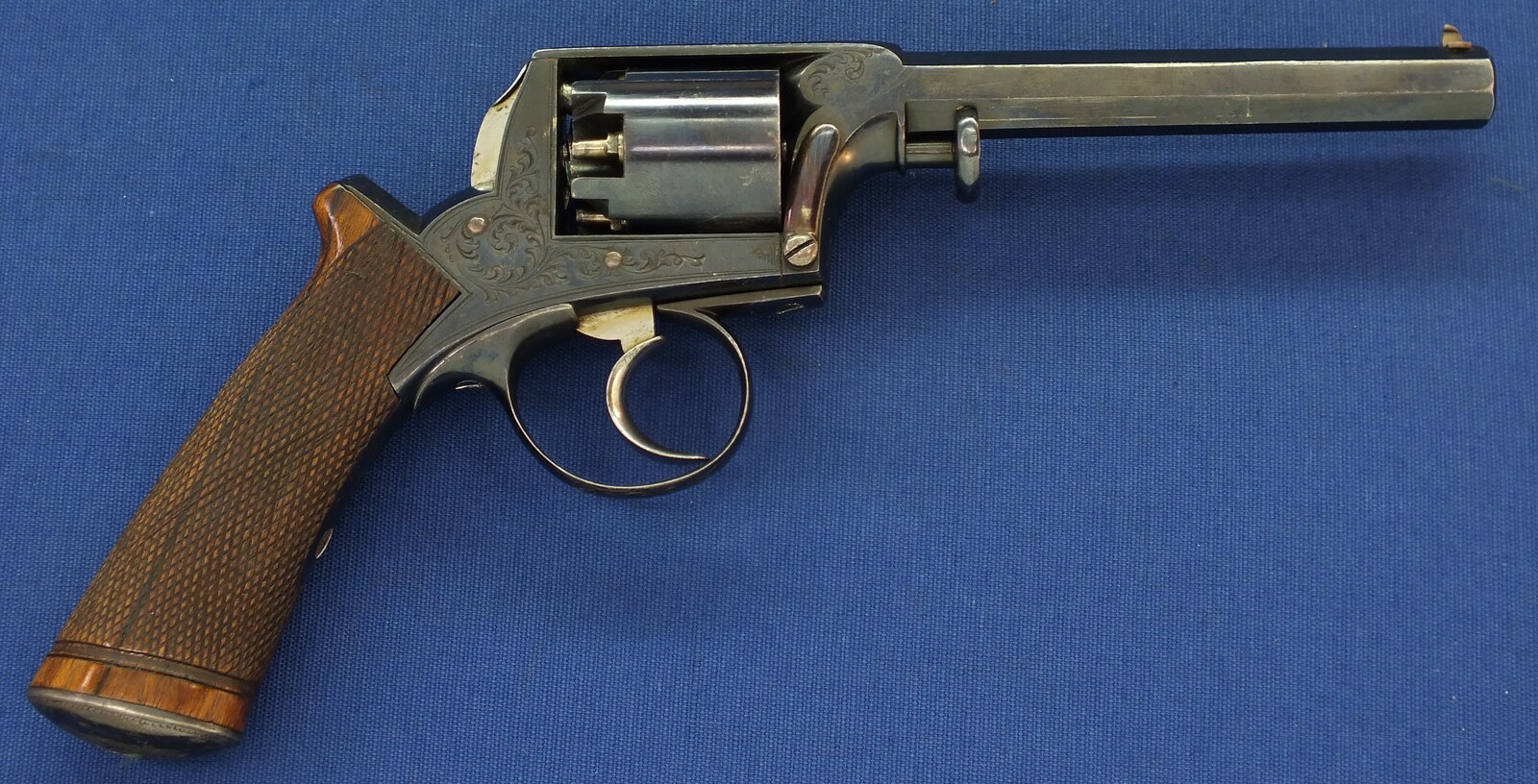 A fine antique probably Belgian made Adams Patent 5 shot double action percussion revolver. 38 Caliber. 5 inch barrel. Length 29cm. In near mint condition. 