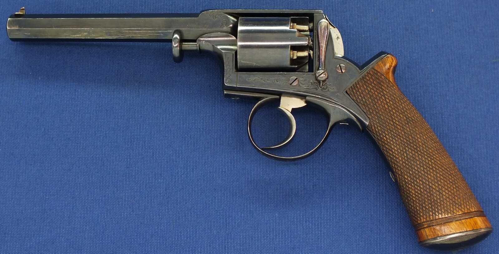 A fine antique probably Belgian made Adams Patent 5 shot double action percussion revolver. 38 Caliber. 5 inch barrel. Length 29cm. In near mint condition. 