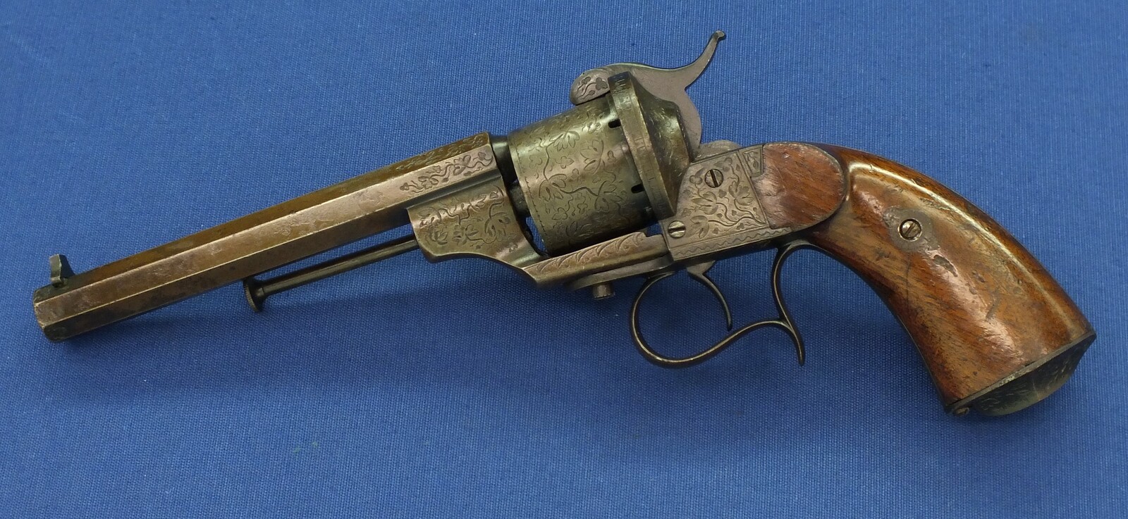 A rare antique French engraved early model 1854 Lefaucheux 6 shot single action 9mm Pinfire Revolver. 6 inch Full octagonal barrel. Length 31cm. In very good condition. 