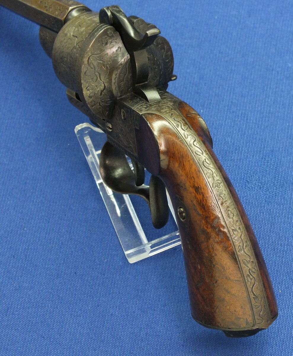 A rare antique French engraved early model 1854 Lefaucheux 6 shot single action 9mm Pinfire Revolver. 6 inch Full octagonal barrel. Length 31cm. In very good condition. 