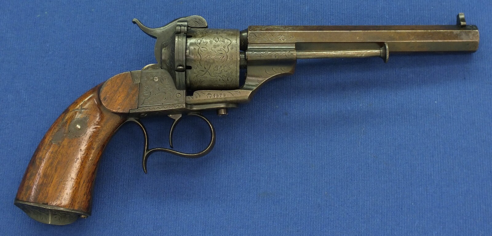 A rare antique French engraved early model 1854 Lefaucheux 6 shot single action 9mm Pinfire Revolver. 6 inch Full octagonal barrel. Length 31cm. In very good condition. 