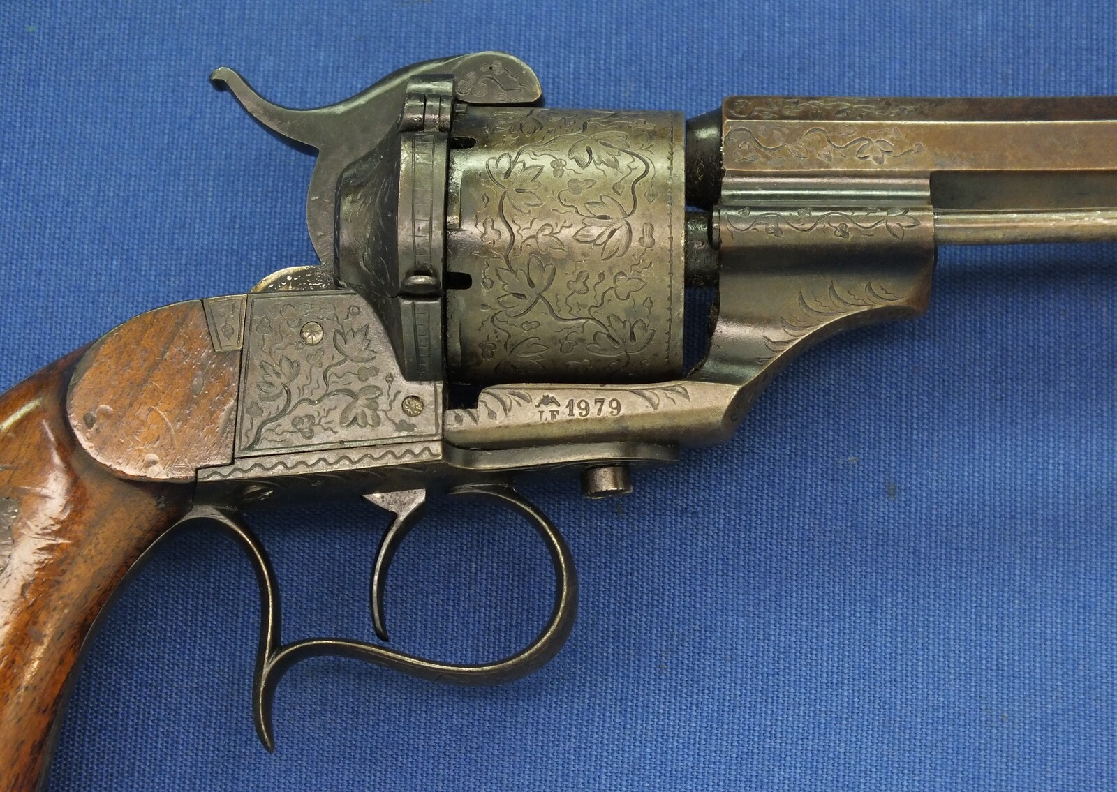 A rare antique French engraved early model 1854 Lefaucheux 6 shot single action 9mm Pinfire Revolver. 6 inch Full octagonal barrel. Length 31cm. In very good condition. 