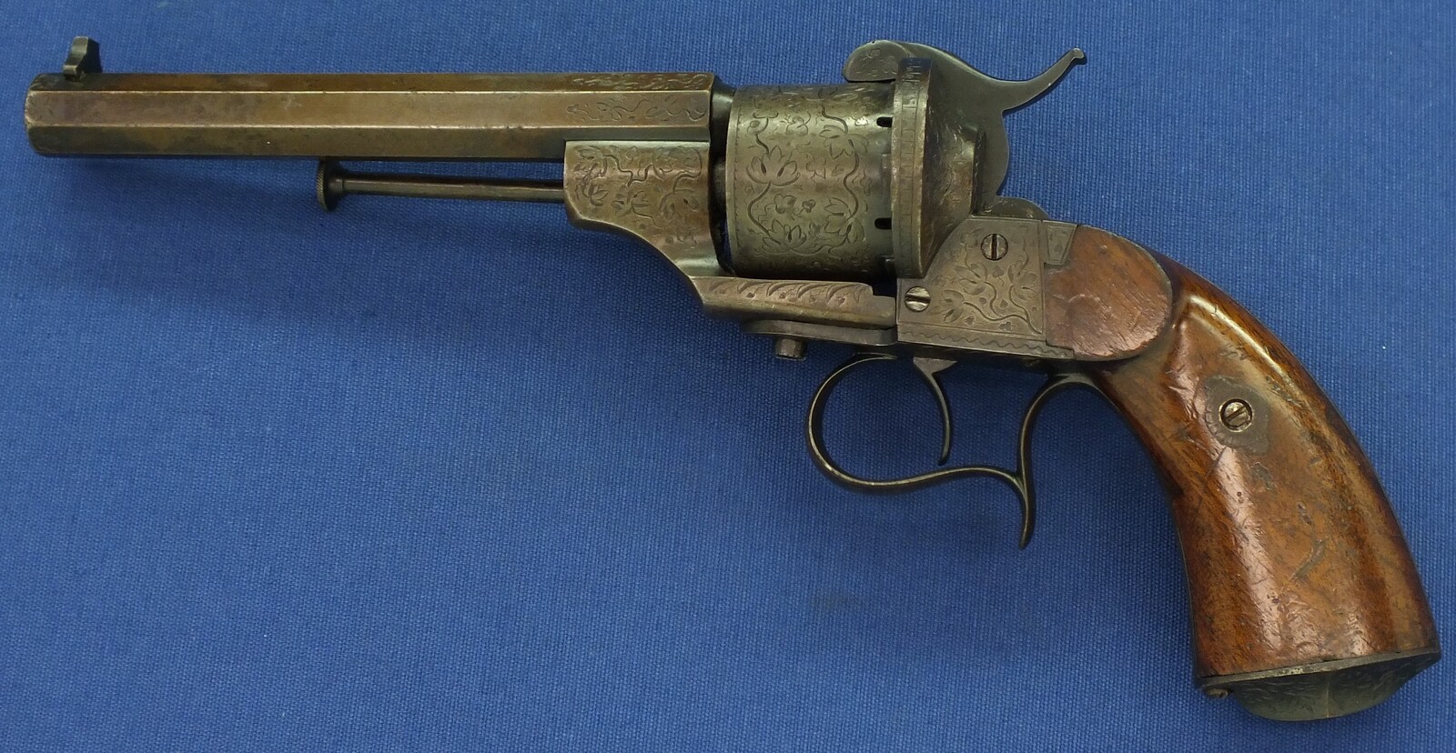 A rare antique French engraved early model 1854 Lefaucheux 6 shot single action 9mm Pinfire Revolver. 6 inch Full octagonal barrel. Length 31cm. In very good condition. 