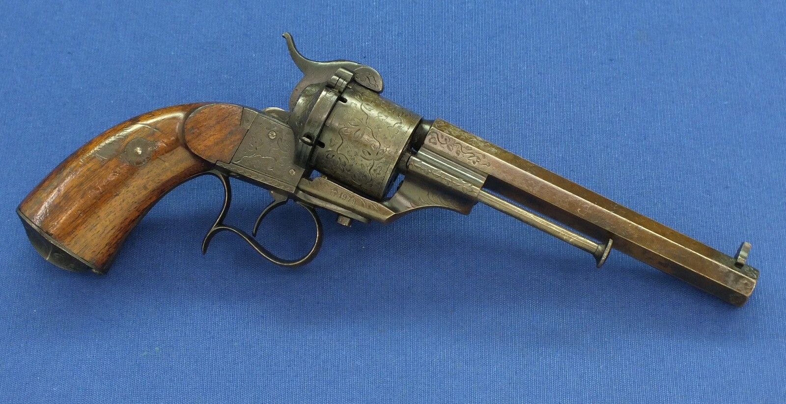 A rare antique French engraved early model 1854 Lefaucheux 6 shot single action 9mm Pinfire Revolver. 6 inch Full octagonal barrel. Length 31cm. In very good condition. 