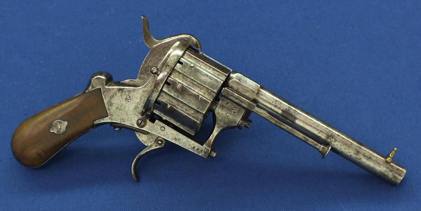 A rare antique German engraved 10 shot Single and Double Action Pinfire Revolver by Kirschbaum Solingen. 6 inch Barrel. Caliber 12mm. Length 30cm. In good/very good Condition. Price 1,350 euro