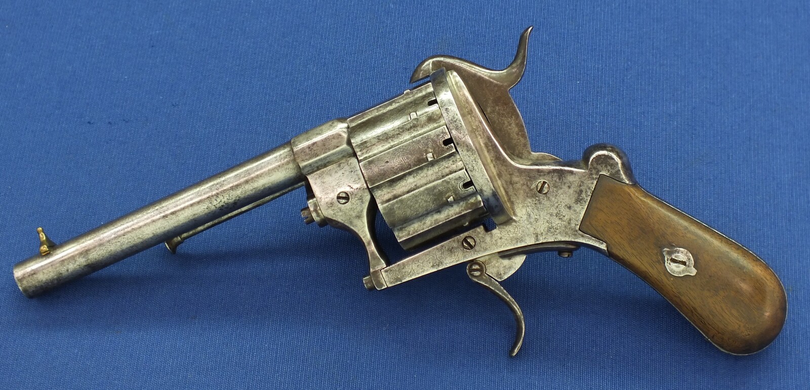 A rare antique German engraved 10 shot Single and Double Action Pinfire Revolver by Kirschbaum Solingen. 6 inch Barrel. Caliber 12mm. Length 30cm. In good/very good Condition. Price 1,350 euro