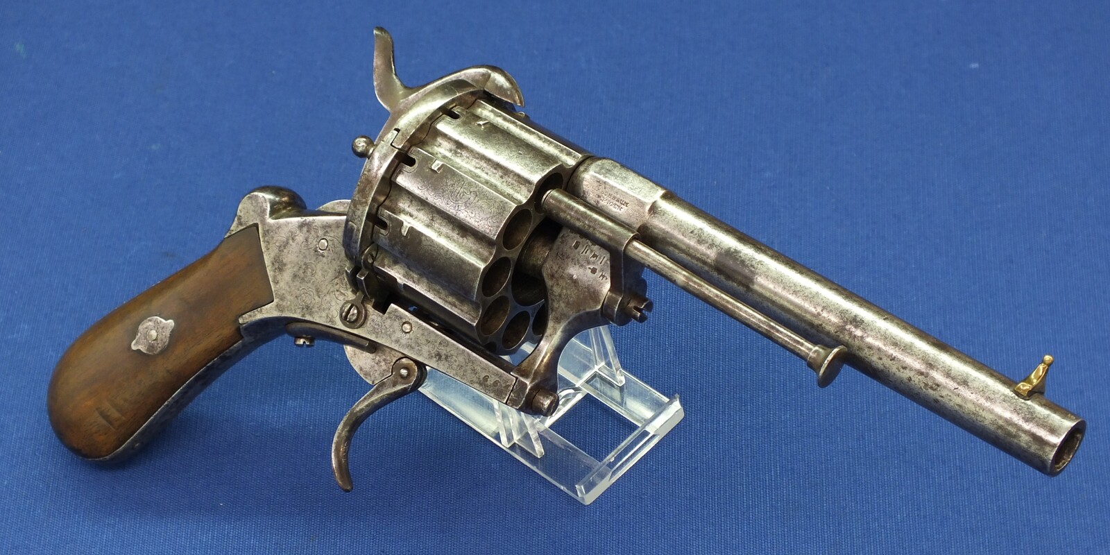 A rare antique German engraved 10 shot Single and Double Action Pinfire Revolver by Kirschbaum Solingen. 6 inch Barrel. Caliber 12mm. Length 30cm. In good/very good Condition. Price 1,350 euro