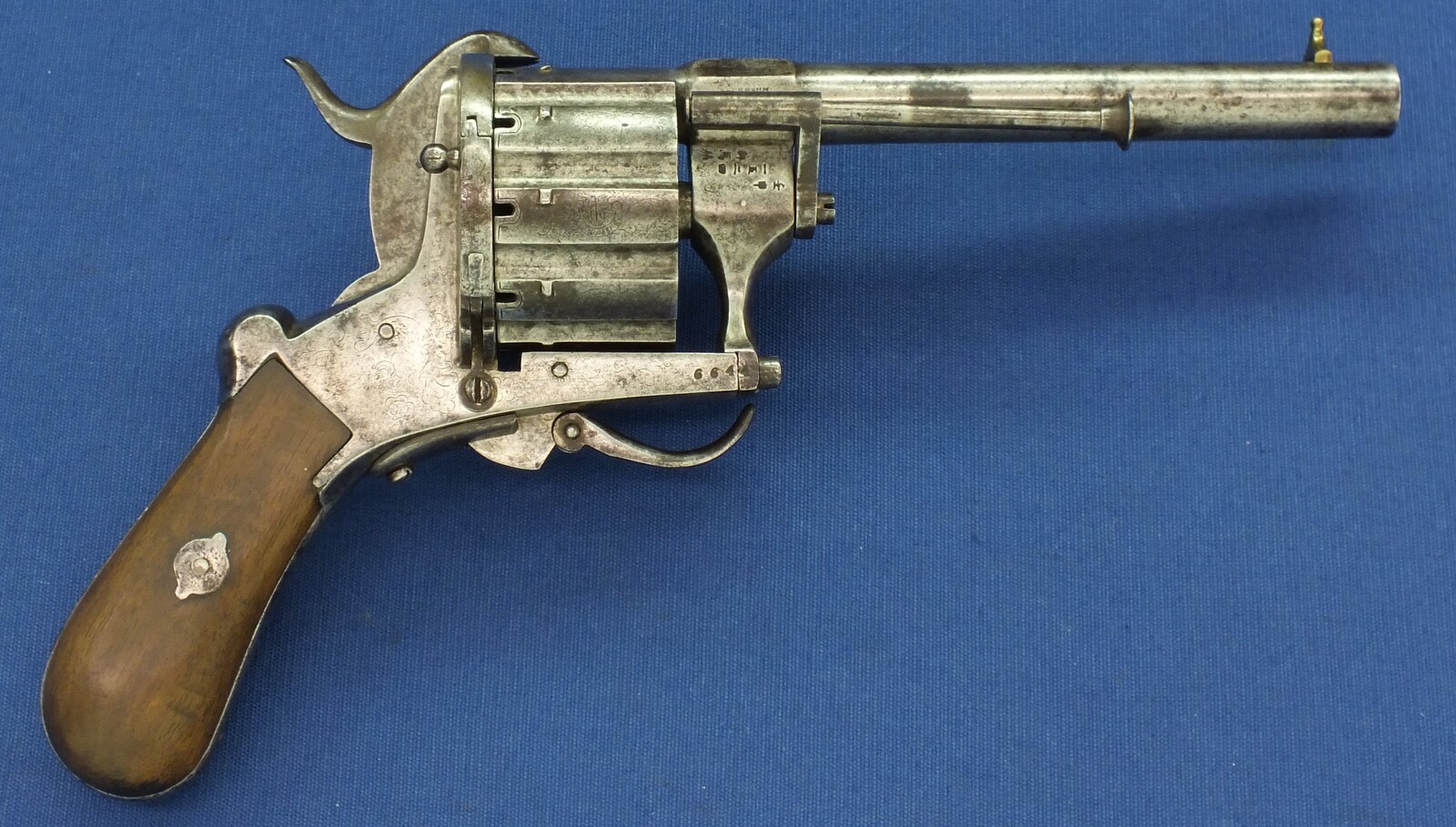 A rare antique German engraved 10 shot Single and Double Action Pinfire Revolver by Kirschbaum Solingen. 6 inch Barrel. Caliber 12mm. Length 30cm. In good/very good Condition. Price 1,350 euro