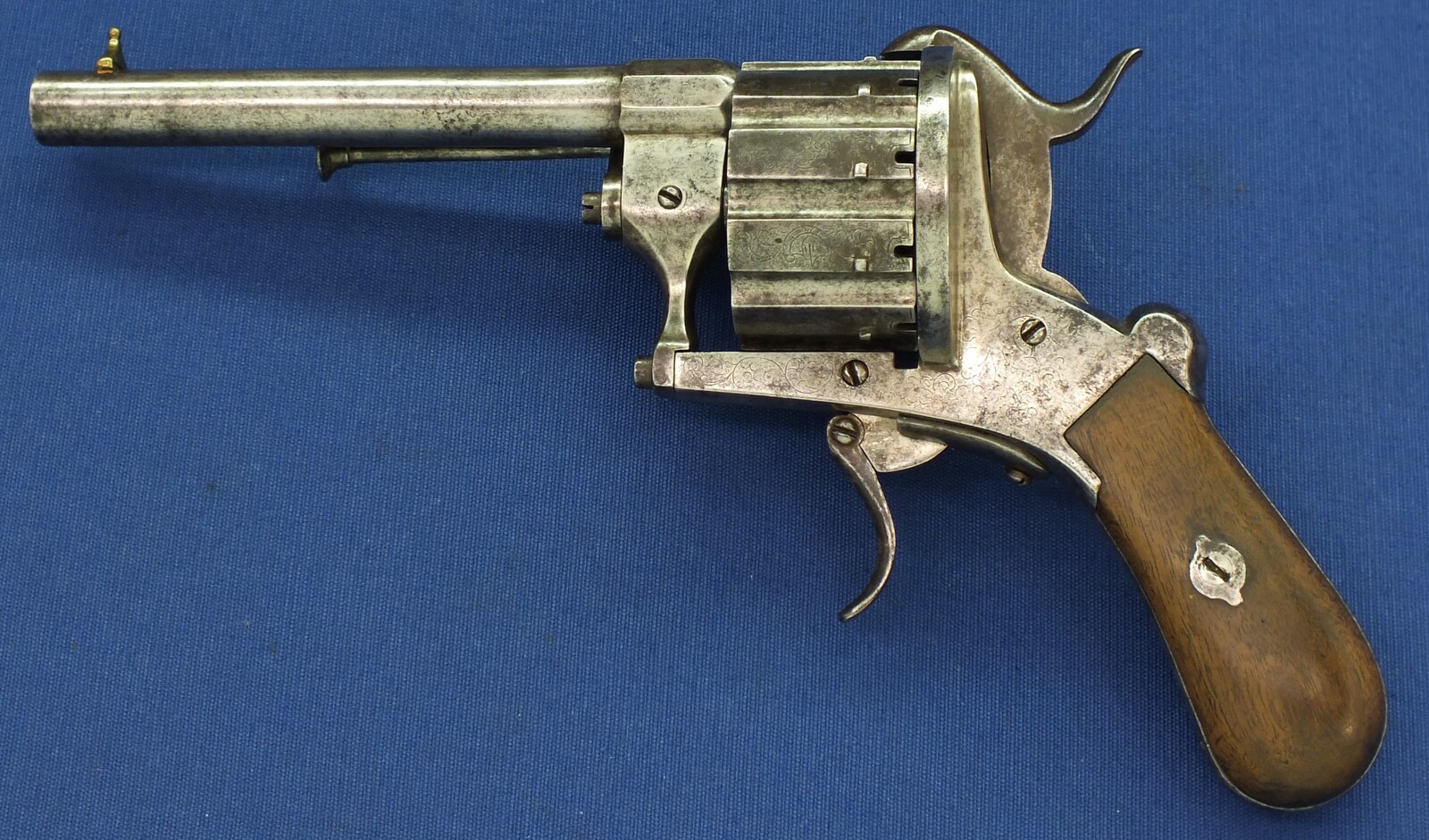 A rare antique German engraved 10 shot Single and Double Action Pinfire Revolver by Kirschbaum Solingen. 6 inch Barrel. Caliber 12mm. Length 30cm. In good/very good Condition. Price 1,350 euro