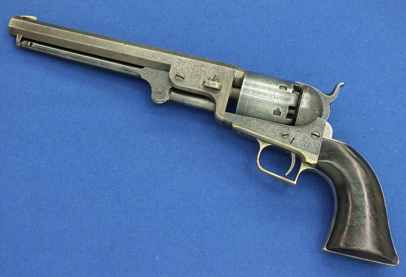 Colt Mod. 1851 Navy,engraved,silver plating,cased,postwar,cal..36,no.  16337. Matching numbers. Octagonal barrel,bright bore,length 7-1/2. Six  shots. Manufactured in 1975. Firm address on barrel,on frame marked Colts  Patent. On cylinder roll