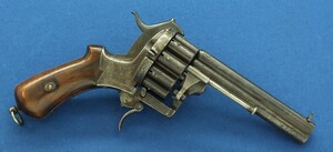 A scarce antique French 20 shot Pinfire Revolver. Signed on barrel: E. Lefaucheux Brevete a Paris. 7mm Caliber, length 27cm. In good/very good condition.