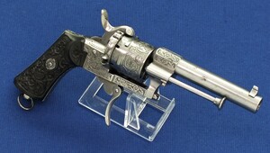 A very nice engraved Belgian Eugene Lefaucheux 6 shot 7mm caliber single and double action Pinfire Revolver with fine carved Ebony grips. Length 21cm. In very good condition. 