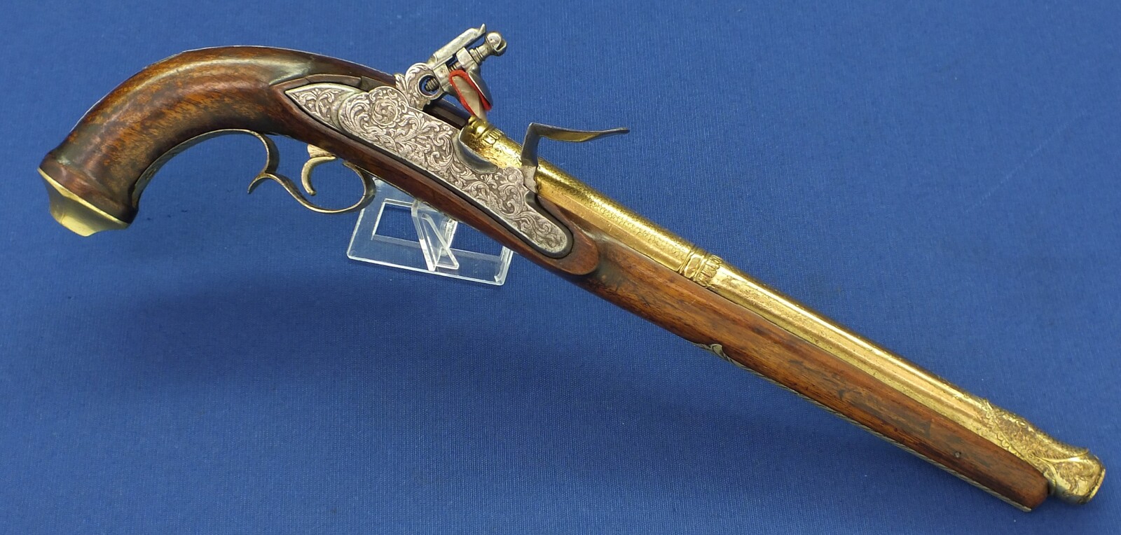 An antique 19th century Eastern Flintlock pistol with decorative gilded Brass Cannon barrel with Fish/Sea monster shaped Muzzle. Length 44cm. Caliber 14mm. In very good condition. Price 1.350 euro