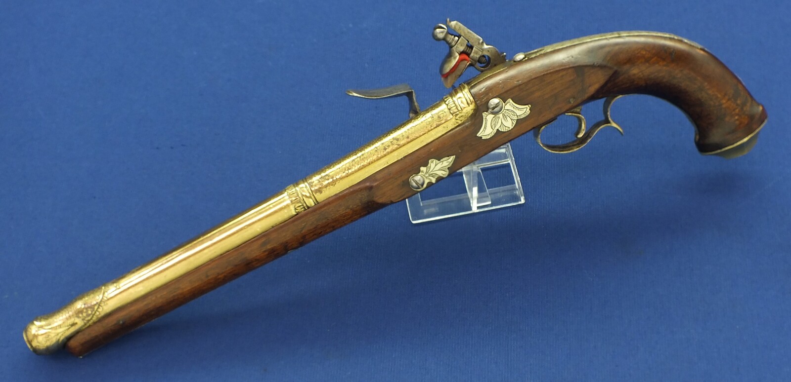 An antique 19th century Eastern Flintlock pistol with decorative gilded Brass Cannon barrel with Fish/Sea monster shaped Muzzle. Length 44cm. Caliber 14mm. In very good condition. Price 1.350 euro