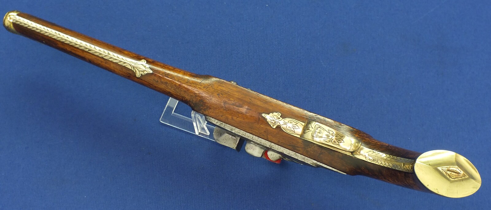 An antique 19th century Eastern Flintlock pistol with decorative gilded Brass Cannon barrel with Fish/Sea monster shaped Muzzle. Length 44cm. Caliber 14mm. In very good condition. Price 1.350 euro