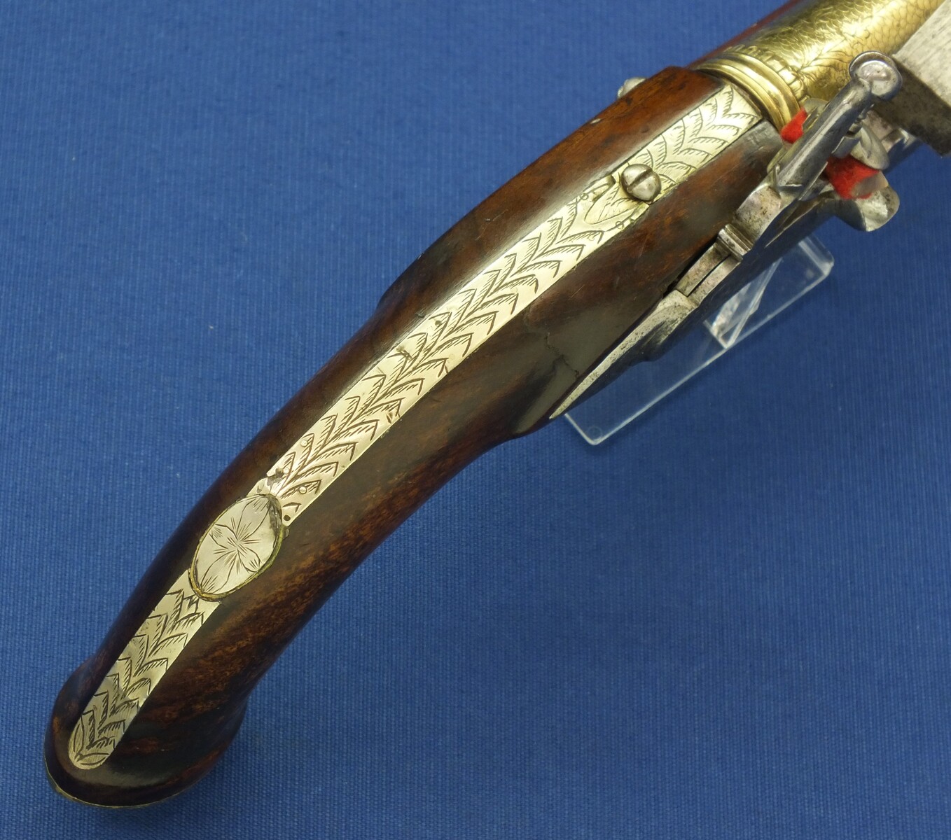 An antique 19th century Eastern Flintlock pistol with decorative gilded Brass Cannon barrel with Fish/Sea monster shaped Muzzle. Length 44cm. Caliber 14mm. In very good condition. Price 1.350 euro