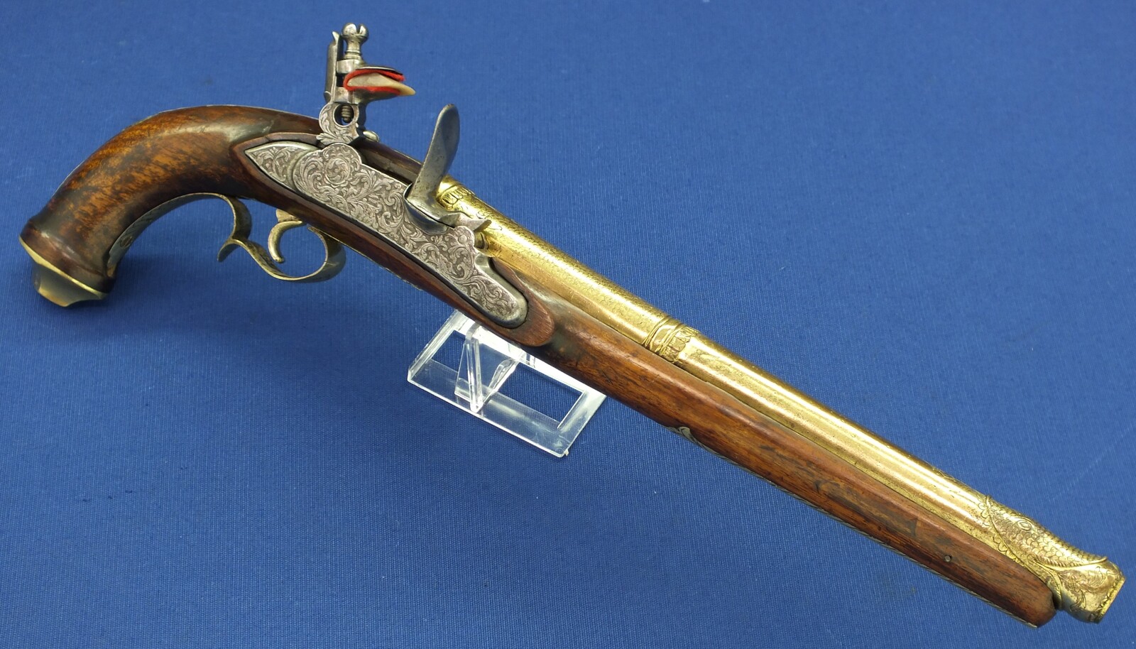 An antique 19th century Eastern Flintlock pistol with decorative gilded Brass Cannon barrel with Fish/Sea monster shaped Muzzle. Length 44cm. Caliber 14mm. In very good condition. Price 1.350 euro