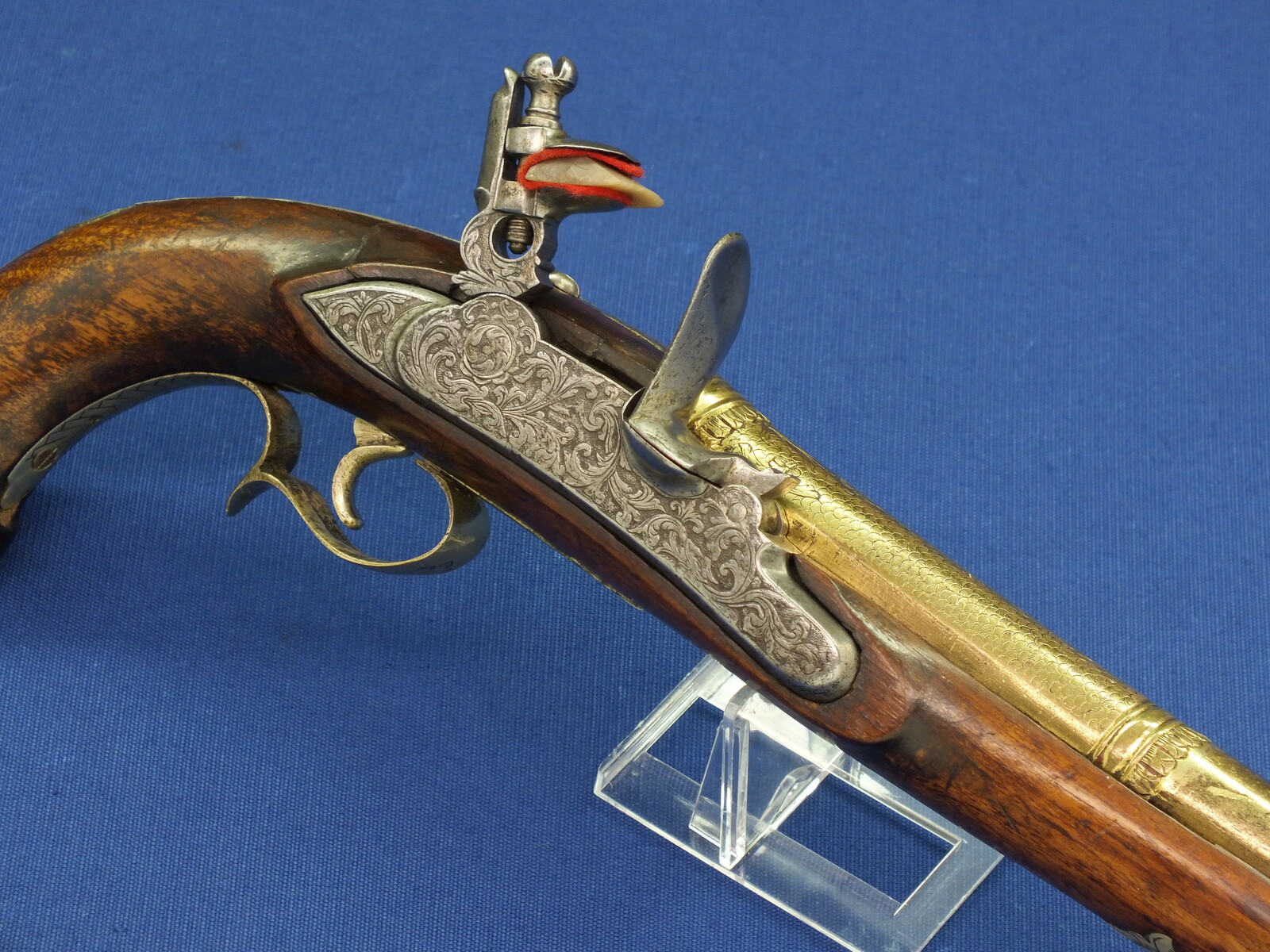 An antique 19th century Eastern Flintlock pistol with decorative gilded Brass Cannon barrel with Fish/Sea monster shaped Muzzle. Length 44cm. Caliber 14mm. In very good condition. Price 1.350 euro