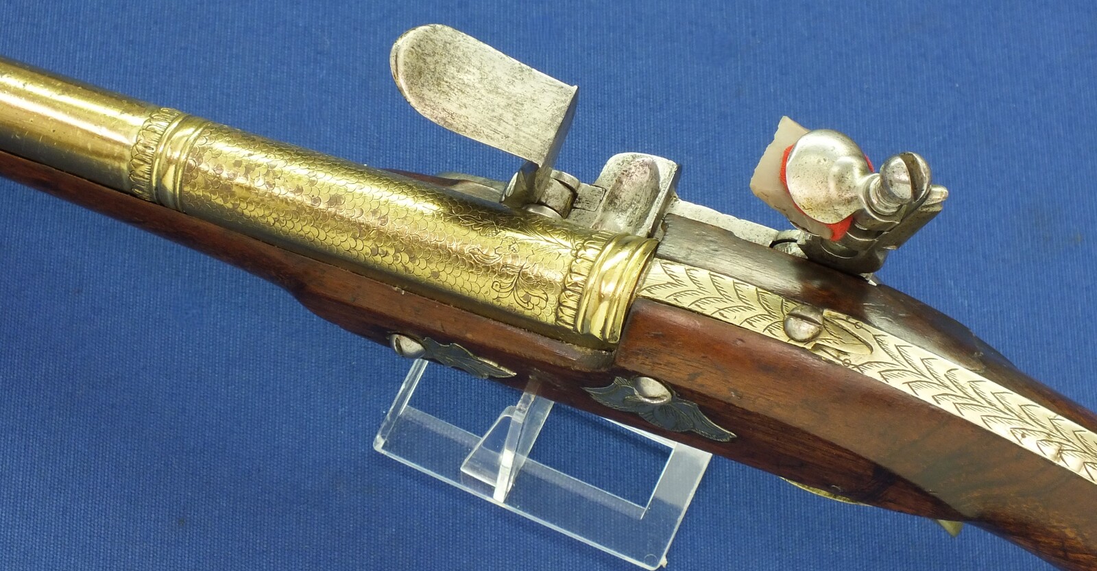 An antique 19th century Eastern Flintlock pistol with decorative gilded Brass Cannon barrel with Fish/Sea monster shaped Muzzle. Length 44cm. Caliber 14mm. In very good condition. Price 1.350 euro