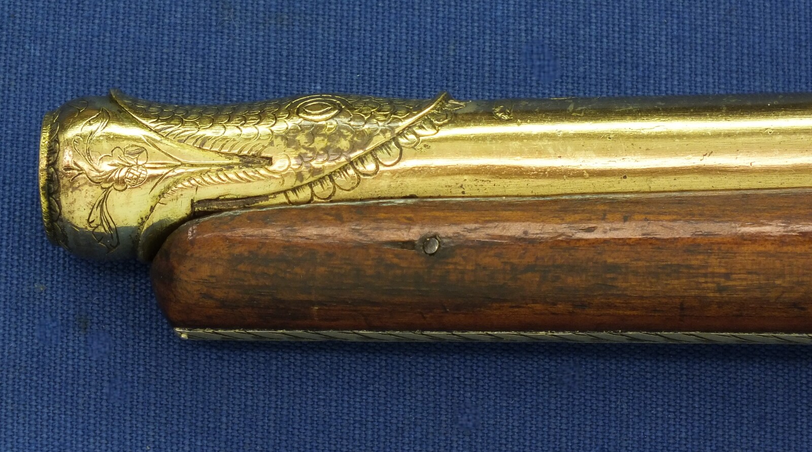 An antique 19th century Eastern Flintlock pistol with decorative gilded Brass Cannon barrel with Fish/Sea monster shaped Muzzle. Length 44cm. Caliber 14mm. In very good condition. Price 1.350 euro