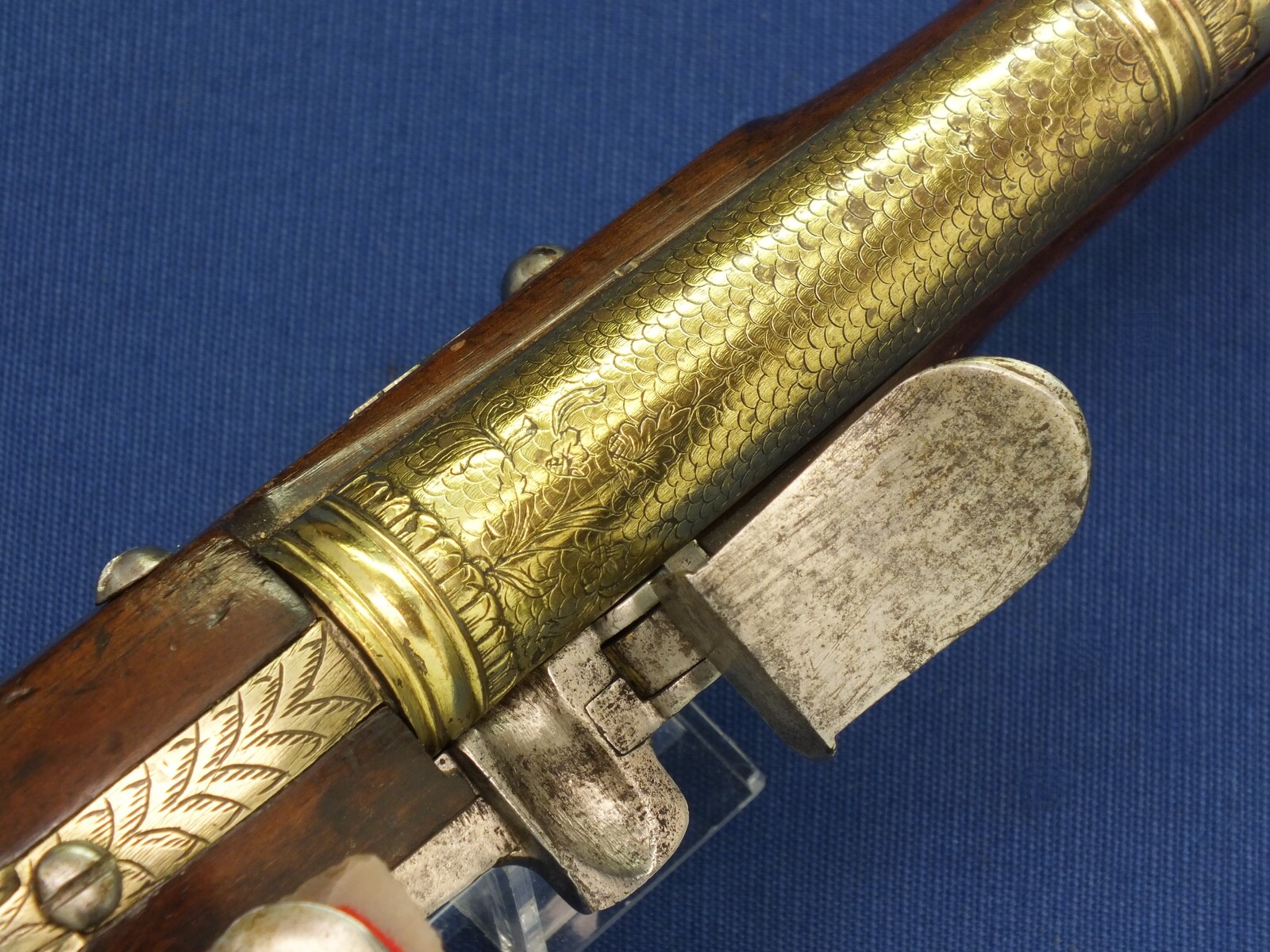 An antique 19th century Eastern Flintlock pistol with decorative gilded Brass Cannon barrel with Fish/Sea monster shaped Muzzle. Length 44cm. Caliber 14mm. In very good condition. Price 1.350 euro