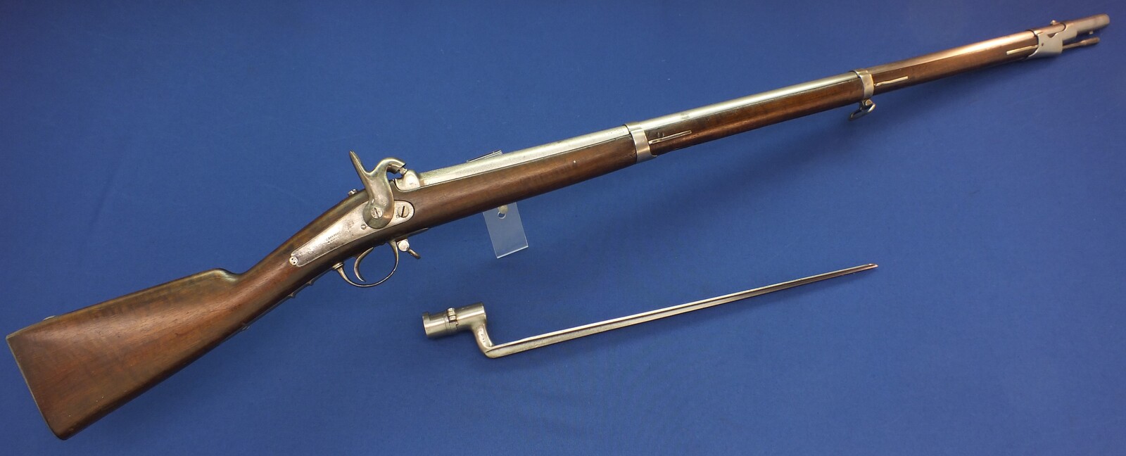 An antique Civil War Period Belgian made French Model 1857 Rifle By C. Dandoy a Liege with original Bayonet. .69 Caliber Rifled. Length 143cm. In very good condition. Price 1.450 euro