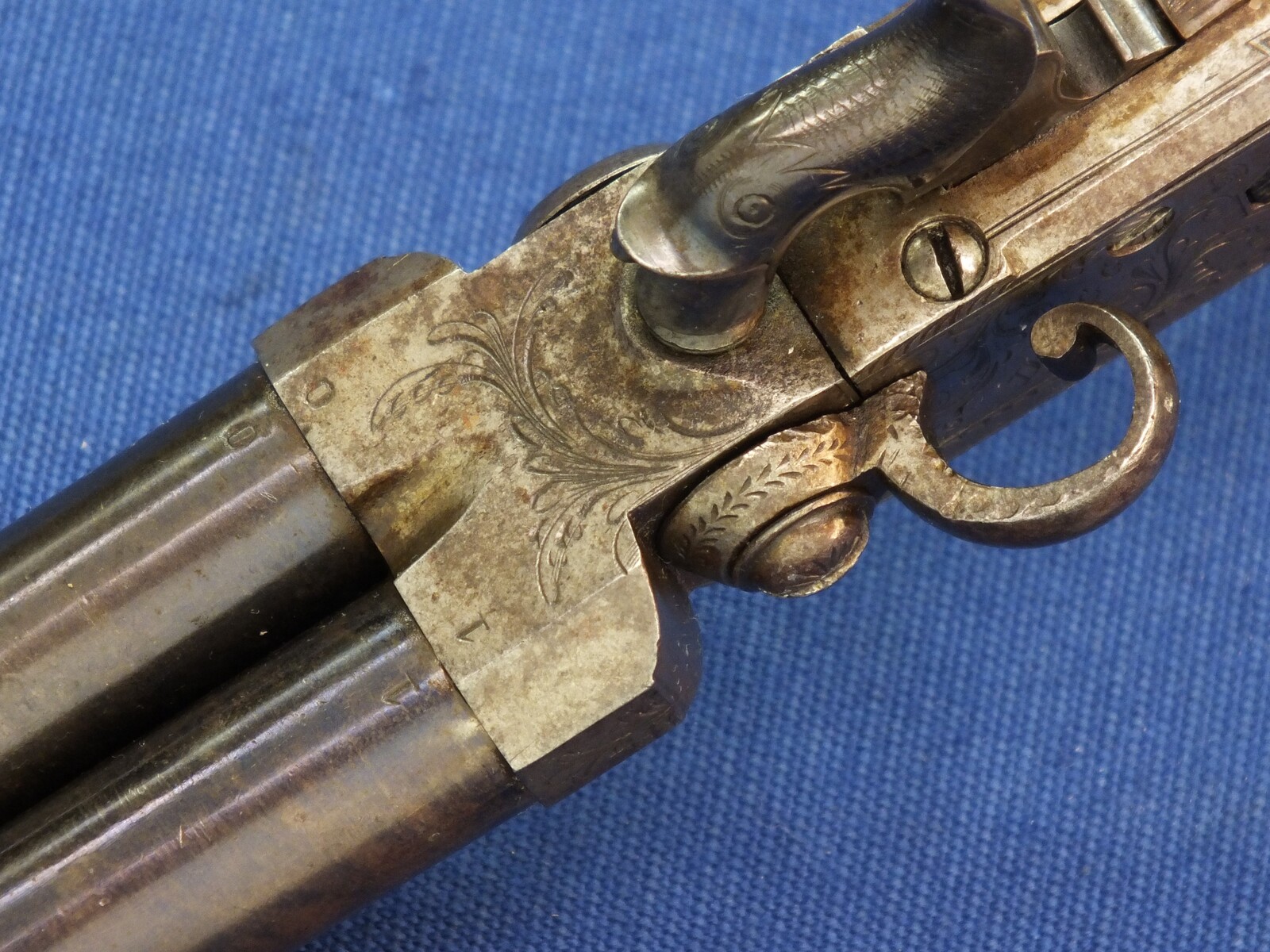 An antique English Box-Lock tap-action side by side Perussion Pistol with thumbpiece safety catch by Durs Egg London. Caliber 9,5mm. Length 16cm. In very good condition. Price 950 euro