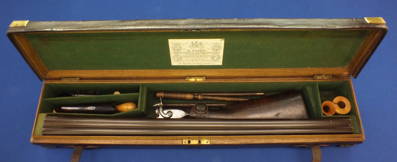 An antique English cased Double barreled Pinfire 12-Bore sporting gun by Robert Adams 76 King William Street London. Adams 1860 Patent No. 285. 30 inch damascus barrels. In good/very good condition. Price 895 euro