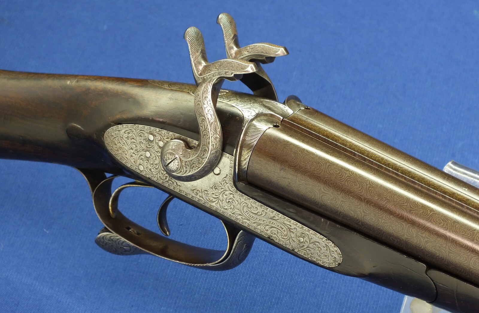 An antique English cased Double barreled Pinfire 12-Bore sporting gun by Robert Adams 76 King William Street London. Adams 1860 Patent No. 285. 30 inch damascus barrels. In good/very good condition. Price 895 euro