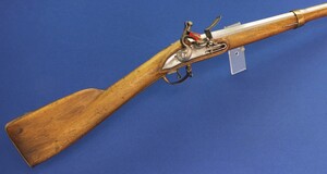 An antique German/Swiss Flintlock musket late 18th century. Caliber 18mm, barrel 108cm. Bronze mounts. Lock and barrel with Suhl markings. Length 146cm. In very good condition.