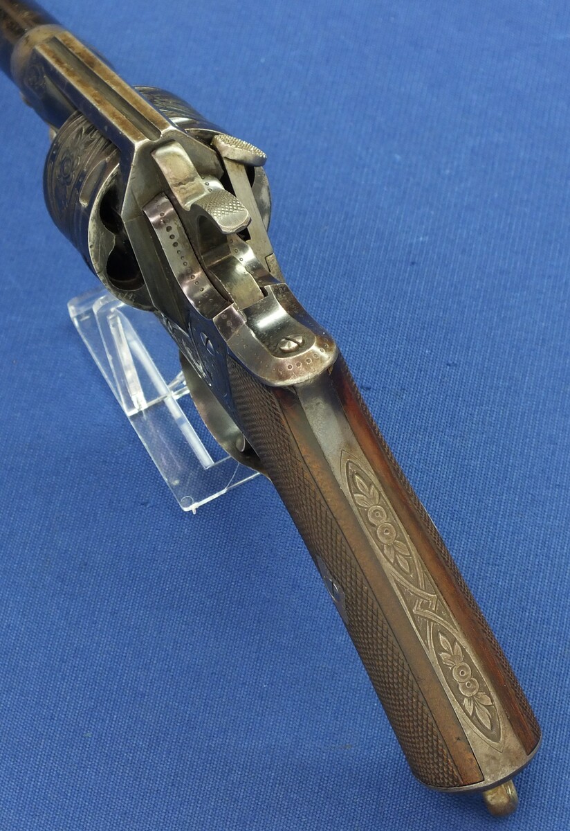 An antique Oak cased Liege made engraved Perrin Model 1865 Single and double action 6 shot Revolver. Caliber 11mm Perrin. Length 31,5cm. In very good condition.