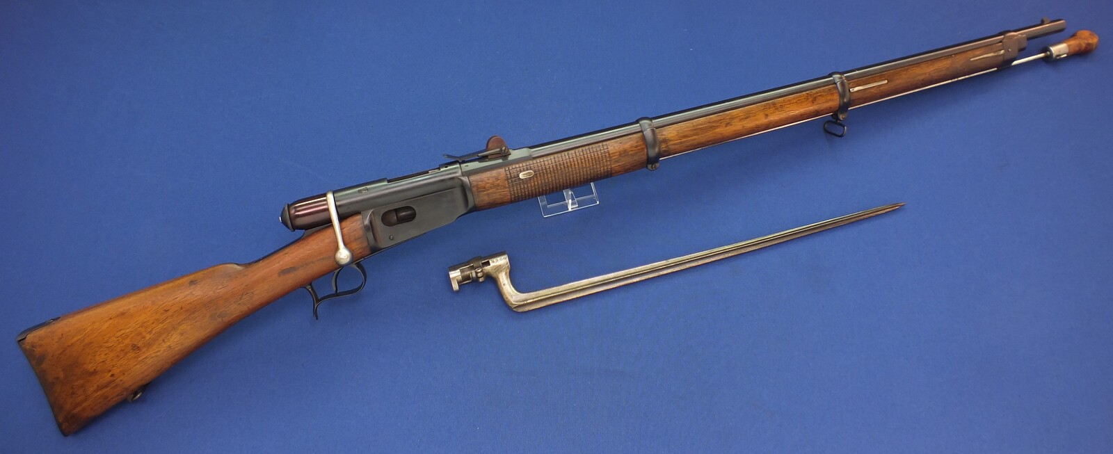 An antique Swiss Vetterli Model 1869-71 Infantery Rifle with Bayonet and screw Driver. Caliber 10,4 Rimfire. Length 130cm. In very good condition. Price 995 euro